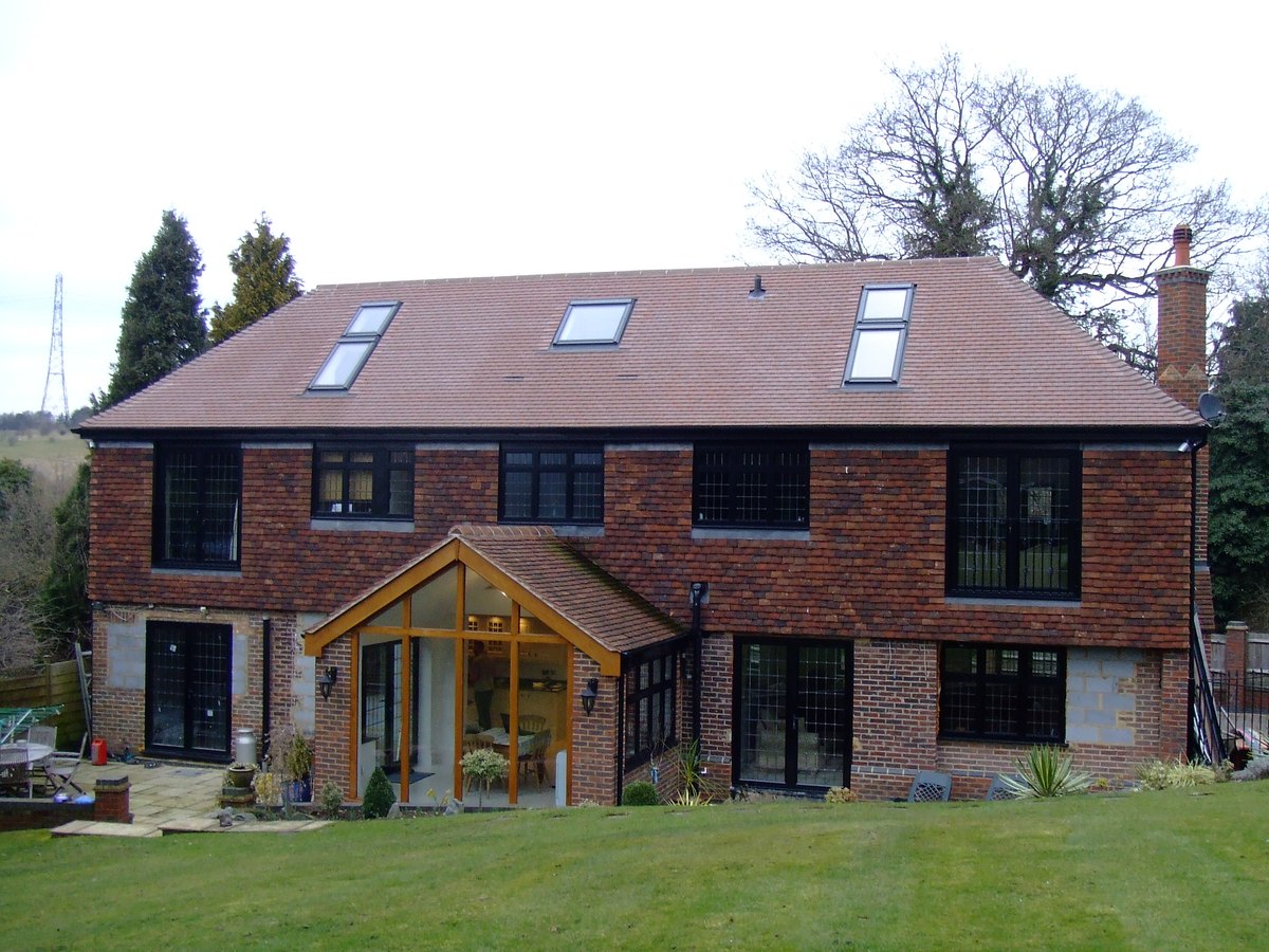 Brick house with a new loft conversion and an oak-framed porch